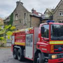 Two teenagers arrested after fire at derelict school in High Peak and emergency services remain at the scene at Linglongs Road in Whaley Bridge. Photo DFRS