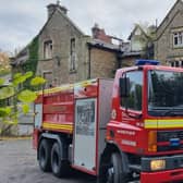 Two teenagers arrested after fire at derelict school in High Peak and emergency services remain at the scene at Linglongs Road in Whaley Bridge. Photo DFRS