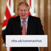 British Prime Minister Boris Johnson holds a news conference addressing the government's response to the coronavirus outbreak (Photo by Simon Dawson-WPA Pool/Getty Images)