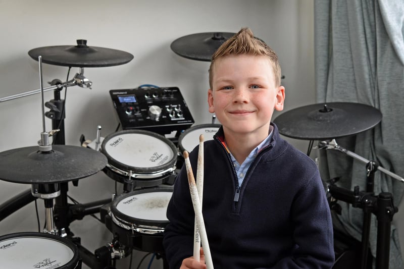 Jared Farmer, aged seven, pictured by his Electric Drums. He has a great talent at such a young age.