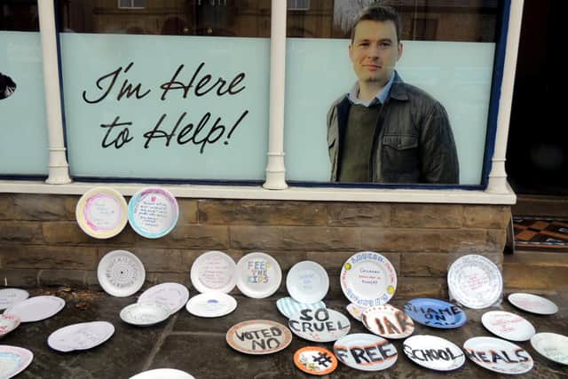 Dozens of people left empty plates outside High Peak MP Robert Largan’s Whaley Bridge office in protest after he voted against extending children’s free school meals