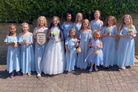 The newly crowned Hayfield May Queen Ava Grace with princess Tilly, Rosebud Fleur, and the rest of her royal retinue for 2023. Pic Hayfield May Queen