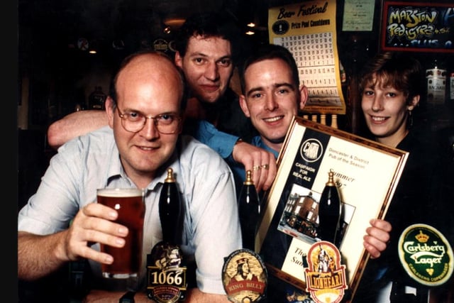 Licensee Sean Lithgo (third left) with the summer pub of the season award certificate which was presented to him in 1997 by Peter Marsh (left) from Doncaster's Camra branch.