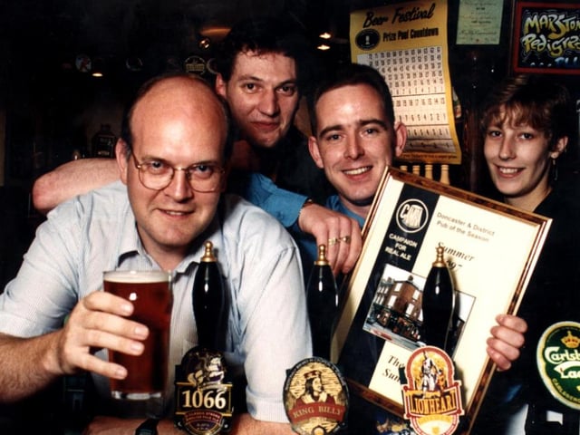 Licensee Sean Lithgo (third left) with the summer pub of the season award certificate which was presented to him in 1997 by Peter Marsh (left) from Doncaster's Camra branch.