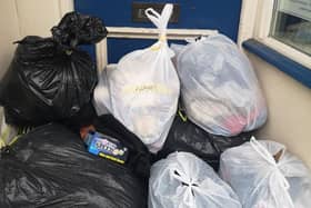 People have been leaving bags piled up outside the shop door