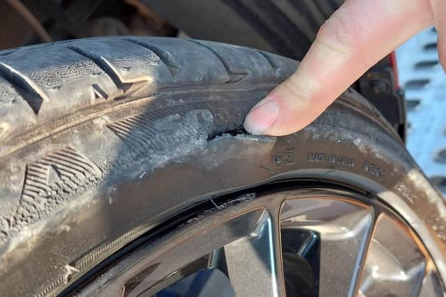 The impact tore through two of Sue's tyres, damaging the wheel rims and tracking.