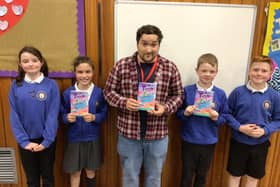 l-r Robyn Piper, 10, Ava Bennet, 10, former pupil Oliver Sykes, Ewan Burns, 9 &amp; Jamie Fay, 10