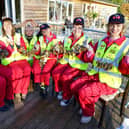 Threading the locks on wires to be hung on a new structure is Emma Harrison, Helen Flack, Mark Henchley, Leica Waine, Alison Thyer and Rose Flack.