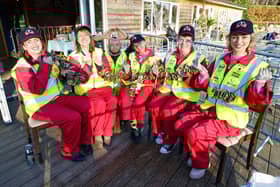 Threading the locks on wires to be hung on a new structure is Emma Harrison, Helen Flack, Mark Henchley, Leica Waine, Alison Thyer and Rose Flack.