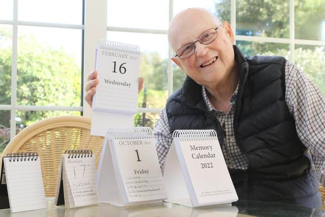 Keith Horncastle with his Memory Calendar and some of the early prototypes he and his late wife used to develop the idea. Pic Jason Chadwick
