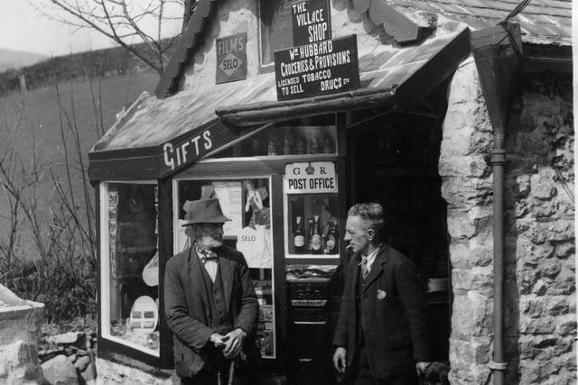 Postmaster William Hubbard, who built Ashopton post office single handedly from local stone, discussing its impending doom with a villager on 20 April 1936. The village was demolished in 1943 before being submerged as part of the the Derwent Valley reservoir scheme. The reservoir was opened as Ladybower Reservoir in 1945.