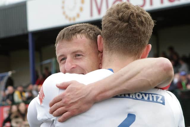 Buxton's players celebrate after their win all but mathematically secured the league championship.