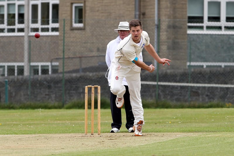 Hadfield's Rick Trunter bowls to New Mills Callum Firth. Picture by Dan Westwell