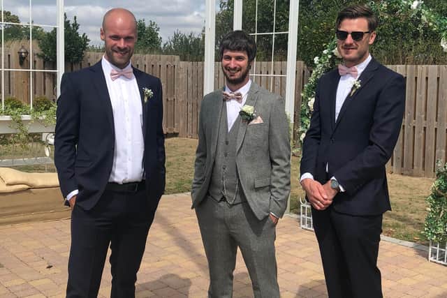 Christopher, left, and Michael at their brother Andrew's wedding in 2018