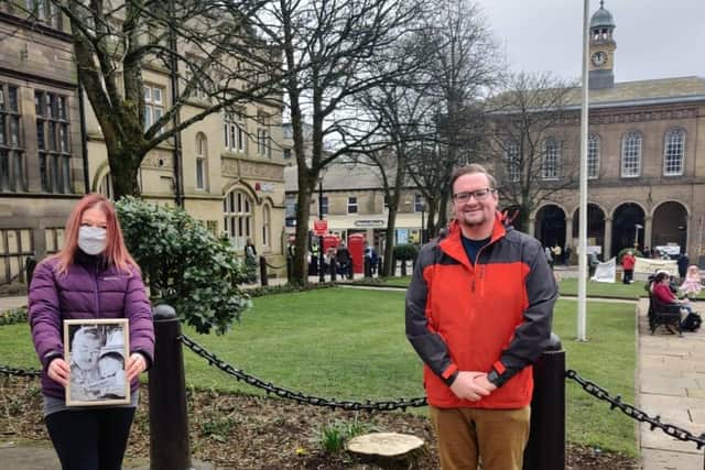 Shirley Woods-Gallagher, holding a picture of her as a young child with her father, and Councillor Damien Greenhalgh in Glossop’s Norfolk Square where one of the memorial trees will be planted.