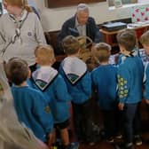 1st Buxton Beavers gather round to look at the miniature bells.
