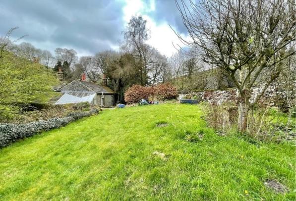 The house sits on a plot extending to approximately three-quarters of an acre.