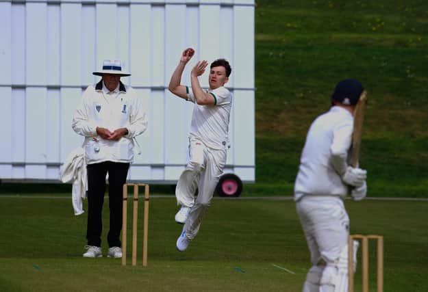 Harry Griffin takes a wicket with the first ball of the game.