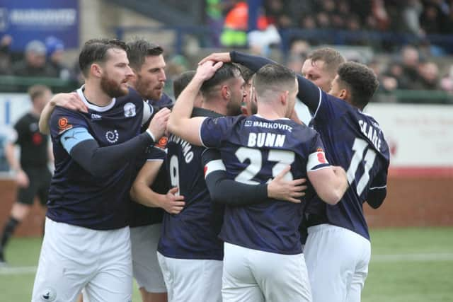 Buxton celebrating the opening goal on Saturday against Merthyr.