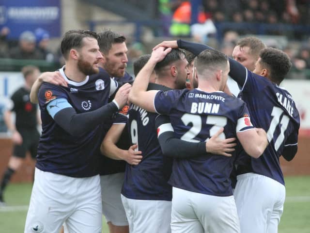 Buxton celebrating the opening goal on Saturday against Merthyr.