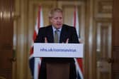 British Prime Minister Boris Johnson gestures as he gives a press conference about the ongoing situation with the coronavirus (COVID-19) outbreak (Photo by Eddie Mulholland - WPA Pool/Getty Images)