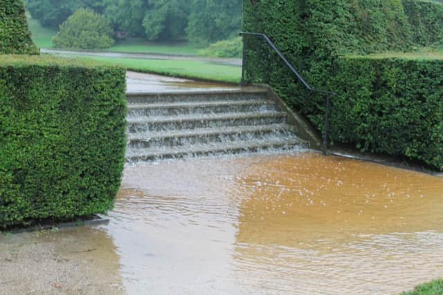 Water cascading down the steps in the garden at Lyme during 2019 floods. (Photo: National Trust)