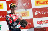Christian Iddon celebrates on the podium. Pic by Mike Petch.