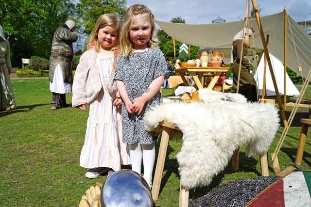 Lola and Emily looking at the 12th century Norman re-enactment group camp . Photo Brian Eyre