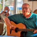 Nigel Barrow getting lost in the performance at Mottram CC, Unplugged And Acoustic group. Photo Ben Wild