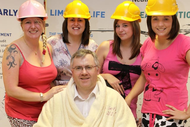 Sara Halsey, Vicky Morrell, Dani Salt and Sarah Bennett with their boss David Patigny all wearing jammies and hard hats for Children in Need in 2011. Photo Jason Chadwick