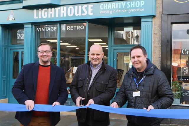 Cllr Damien Greenhalgh, shop owner Phil Bradbury and Lighthouse CEO Ian Tannahill celebrate the renovationof  the Lighthouse shop on Spring Gardens. Photo Jason Chadwick