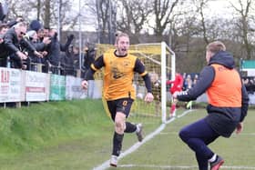 Joe Bevan celebrates New Mills' dramatic late winner.