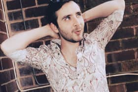 Buxton musician Isaac Neilson who is doing gig a day for a year to create his own momentum in music industry was invited down to Parliament to talk about making music.