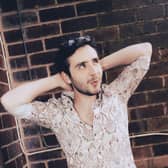 Buxton musician Isaac Neilson who is doing gig a day for a year to create his own momentum in music industry was invited down to Parliament to talk about making music.