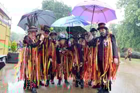 A bit of rain will not extinguish the group's fiery spirits.