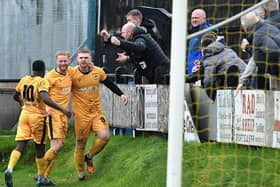 New Mills celebrate Saturday's third goal with fans - photo by Fryerpix.