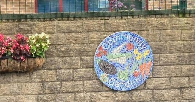 Community artists made two mosaics for a community garden. Photo submitted