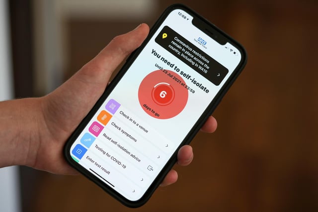 The NHS Covid-19 app alerts the user "You need to self-isolate". Photo illustration by Christopher Furlong/Getty Images.
