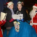 Queen Katelyn and her retinue singing a carol at the 2013 lights switch on. Photo Jason Chadwick