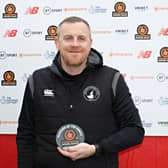 Craig Elliott with his February Manager of the Month award.