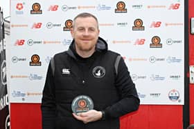 Craig Elliott with his February Manager of the Month award.