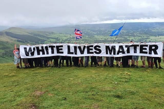 The group unfurl the banner on Mam Tor  - photo by Patriotic Alternative