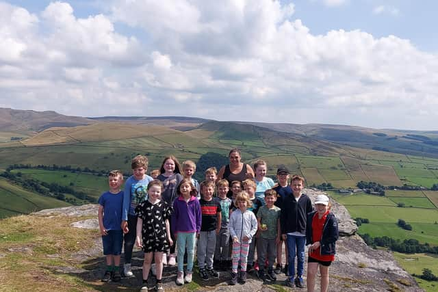 The children from Little Jules in New Mills at the top of Big Stone, one of the five sponsored walks they are doing to raise funds for a defibrillator.