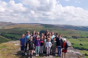 The children from Little Jules in New Mills at the top of Big Stone, one of the five sponsored walks they are doing to raise funds for a defibrillator.
