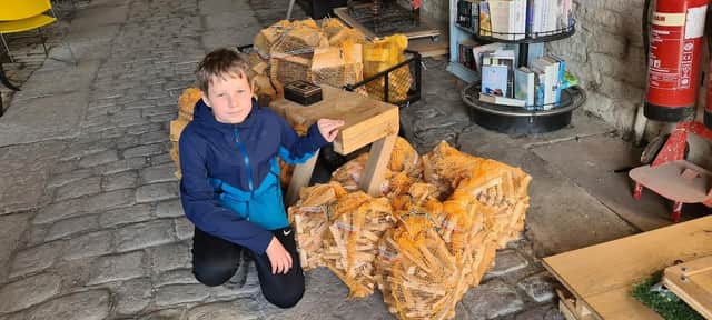 Gregory Dent has been selling logs to raise money for the Whaley Bridge foodbank and the money will be used to buy meals for Christmas Day. Photo submitted