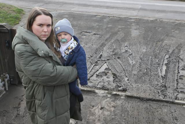 Hannah Wardle and her baby are living in a sea of mud that comes right up to the house. Photo Jason Chadwick