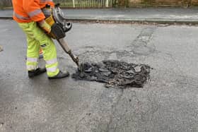 Pictured Is A Derbyshire County Council Worker Repairing One Of The Many Potholes On The County'S Roads