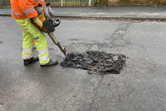 Pictured Is A Derbyshire County Council Worker Repairing One Of The Many Potholes On The County'S Roads