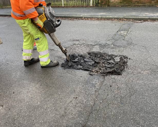 Pictured Is A Derbyshire County Council Worker Repairing One Of The Many Potholes On The County'S Roads