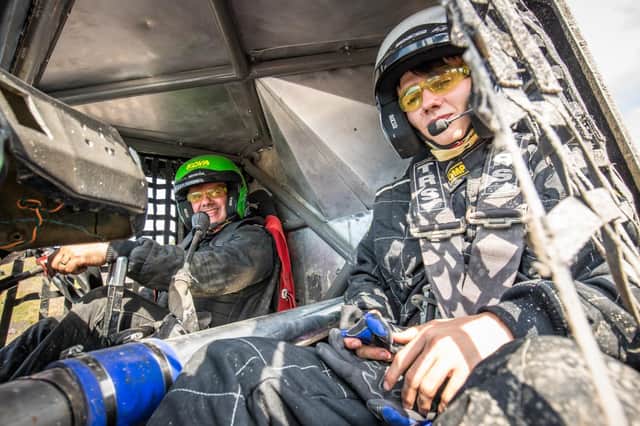 Harvey Gallemore in the cockpit with his dad, Alex, alongside him.